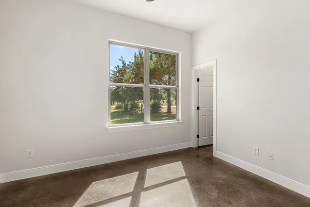 an empty room with windows