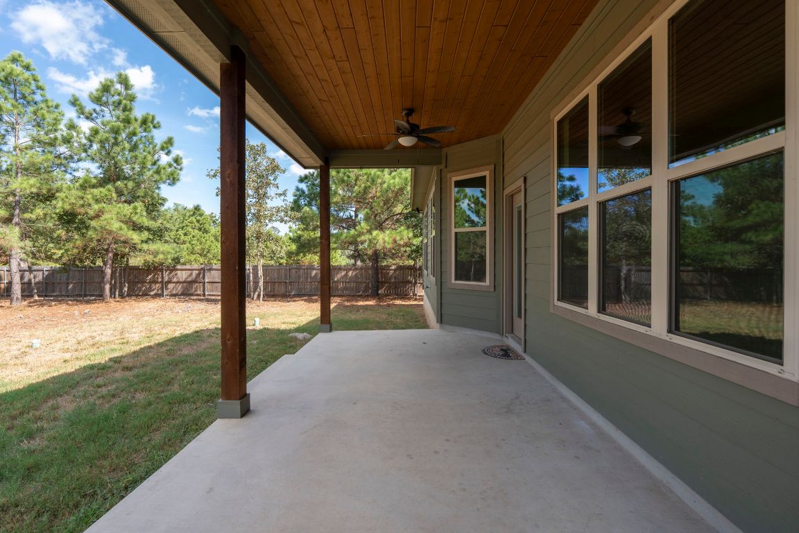 203 Cardinal Loop Paige, TX 78659 - Photo 25 of 36 a view of a house with backyard and porch