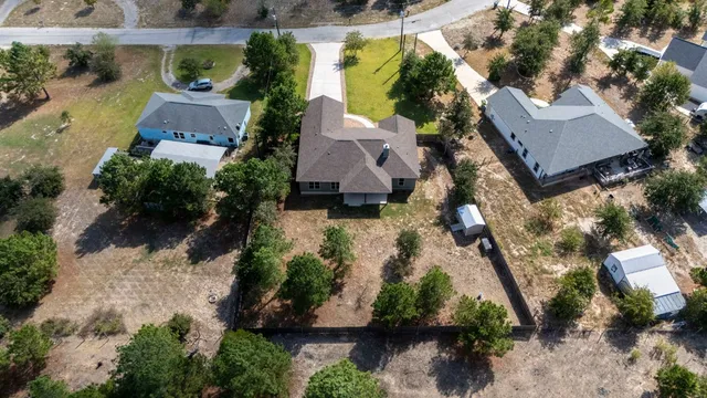an aerial view of house with yard