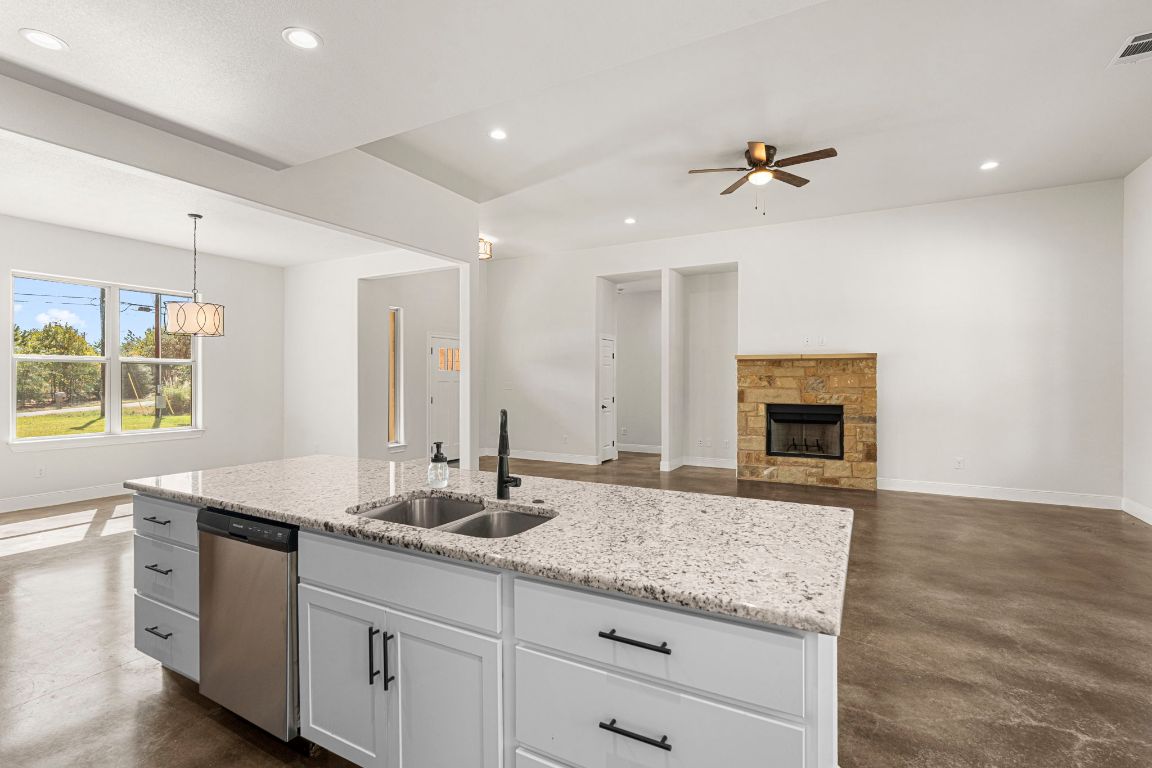 203 Cardinal Loop Paige, TX 78659 - Photo 4 of 36 a bathroom with a sink and a mirror