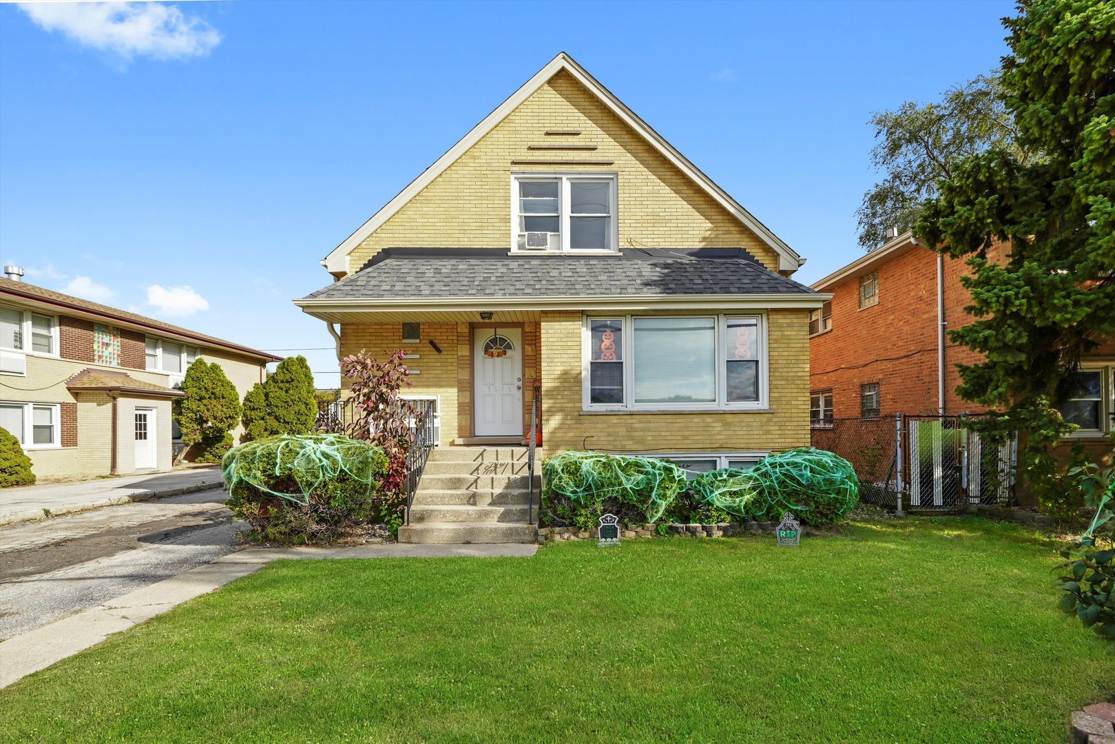 a front view of a house with a yard