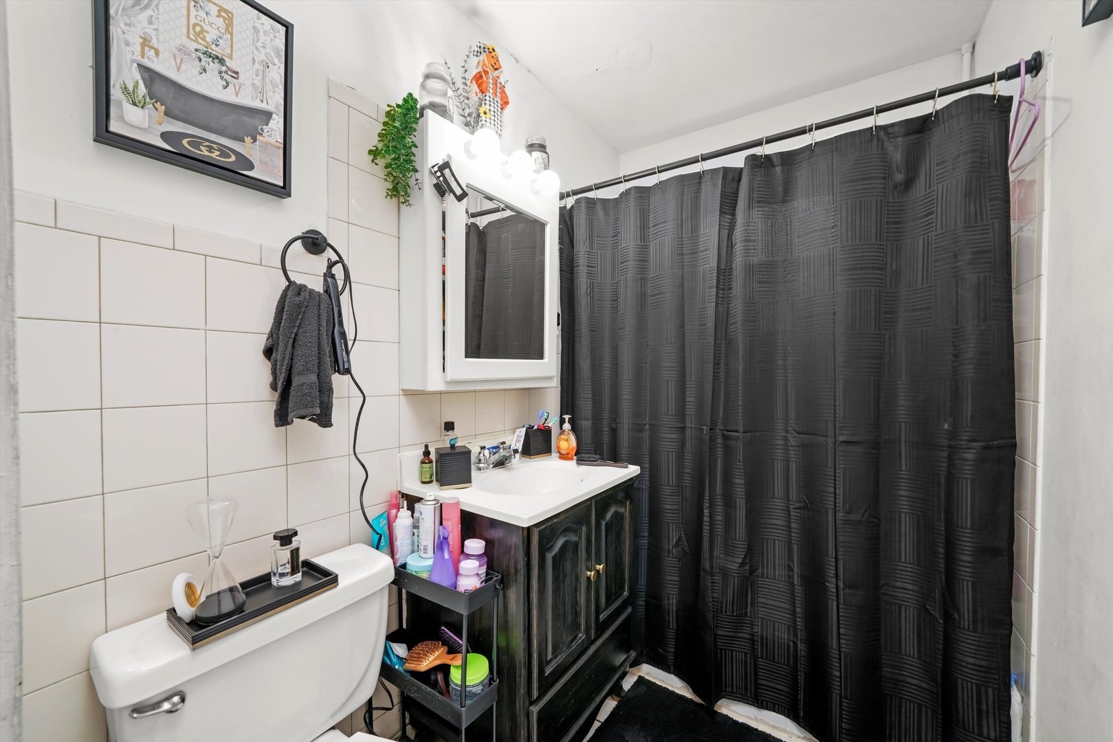 7549 Roberts Road Bridgeview, IL 60455 - Photo 12 of 19 a bathroom with a sink vanity and toilet