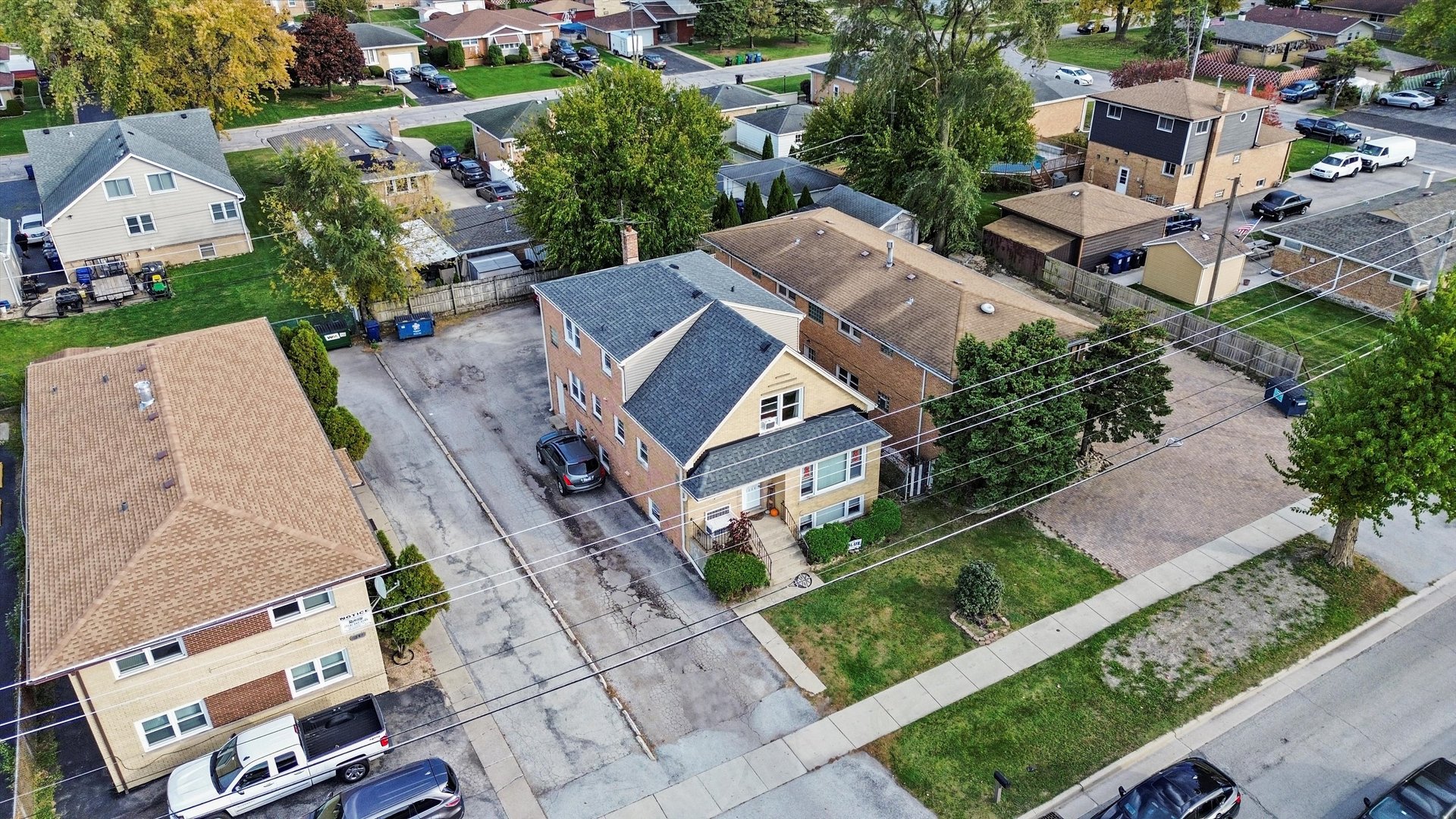 7549 Roberts Road Bridgeview, IL 60455 - Photo 15 of 19 an aerial view of a house with a garden