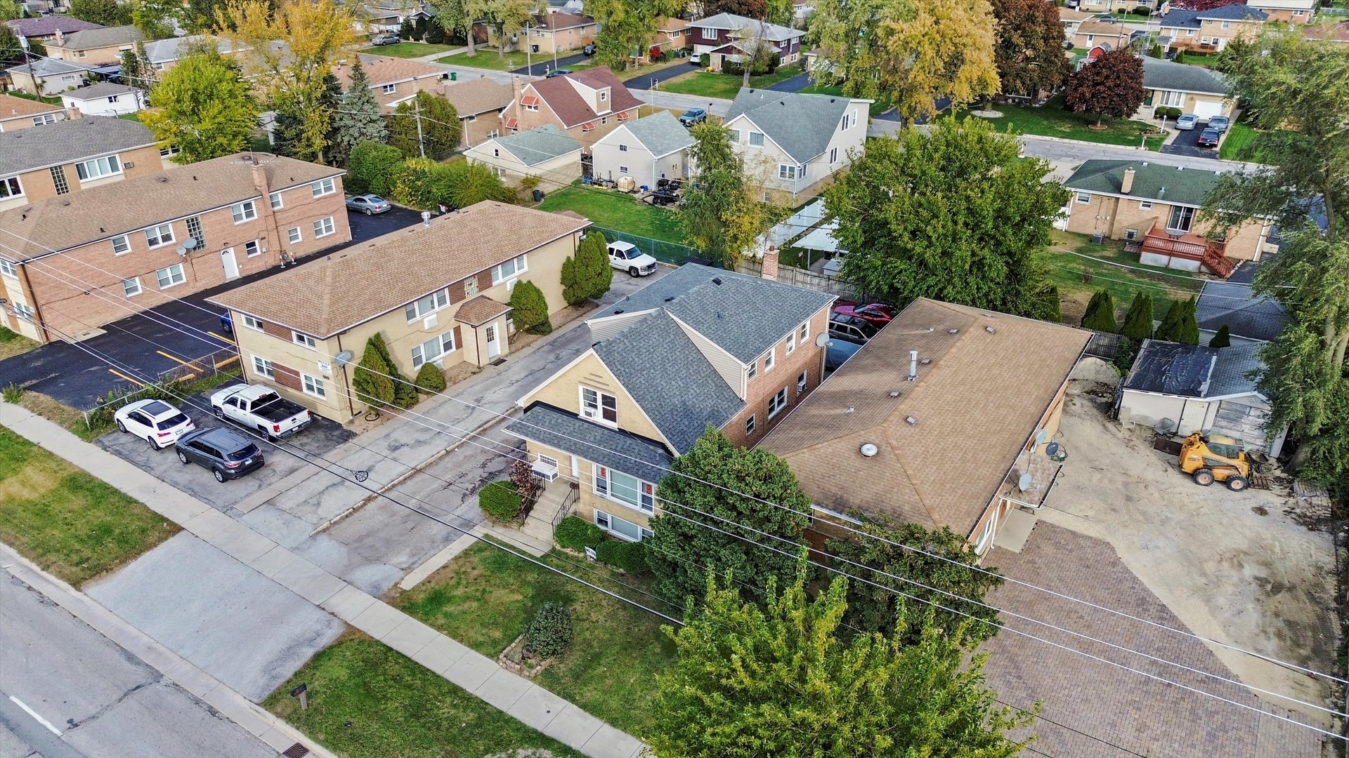 7549 Roberts Road Bridgeview, IL 60455 - Photo 17 of 19 an aerial view of multiple houses with yard