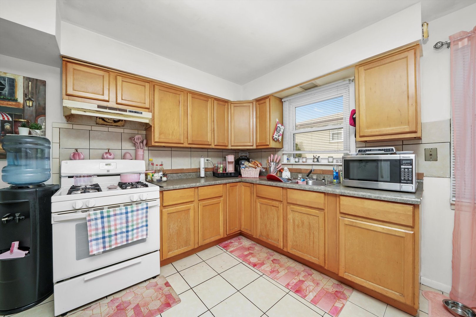 7549 Roberts Road Bridgeview, IL 60455 - Photo 4 of 19 a kitchen with stainless steel appliances granite countertop a sink stove and cabinets