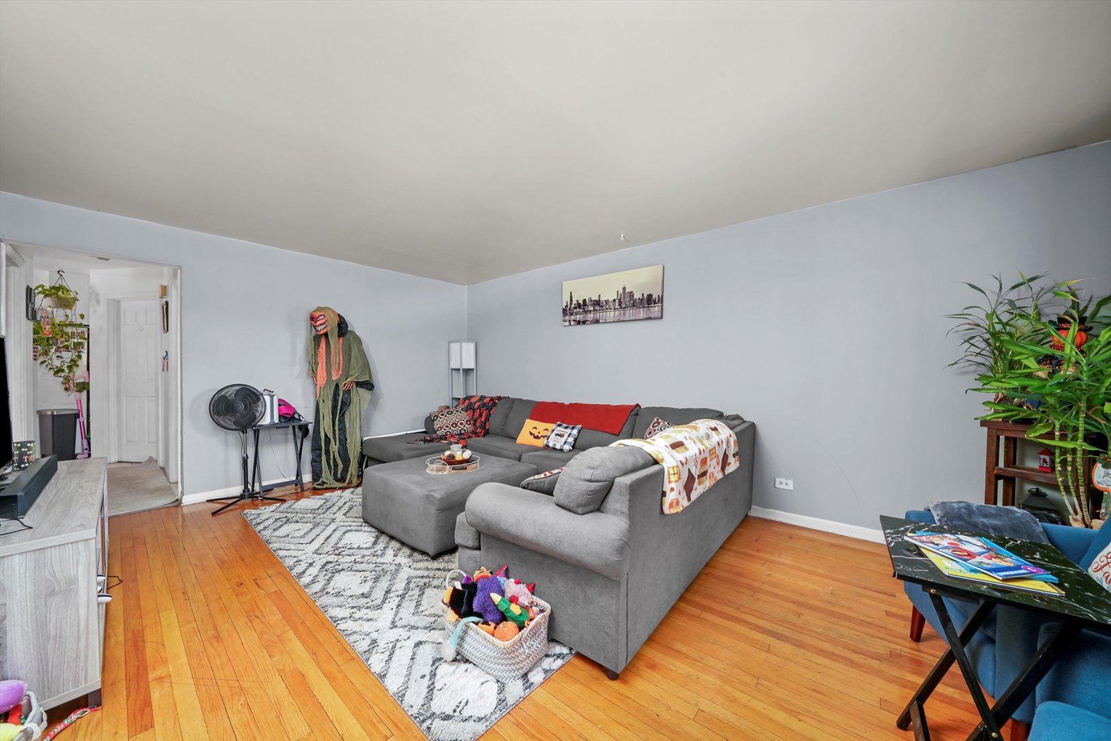 7549 Roberts Road Bridgeview, IL 60455 - Photo 8 of 19 a bedroom with furniture and a wooden floor