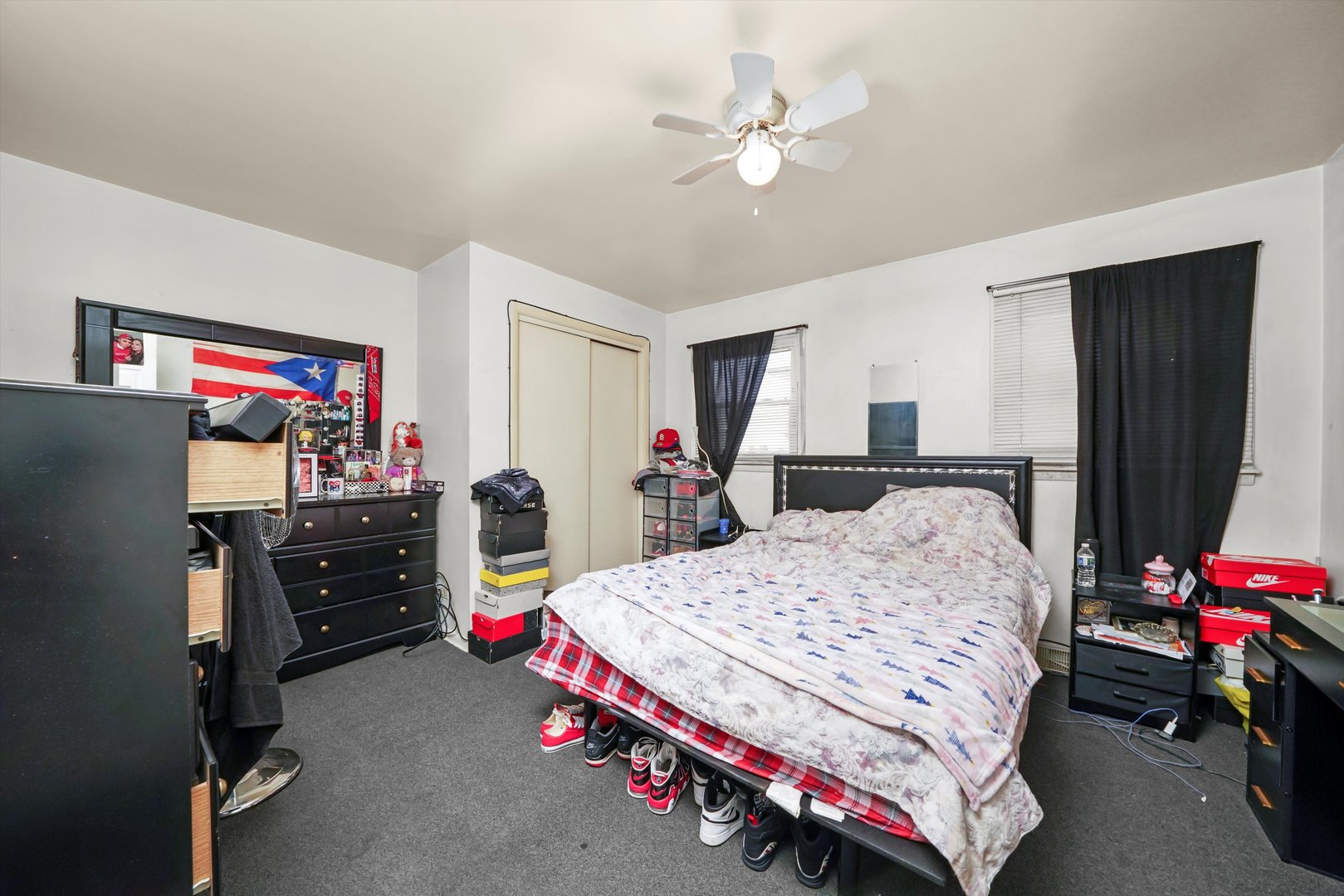 7549 Roberts Road Bridgeview, IL 60455 - Photo 9 of 19 a bedroom with a bed and a flat screen tv