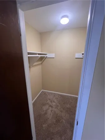 view of a room with rack on the wall