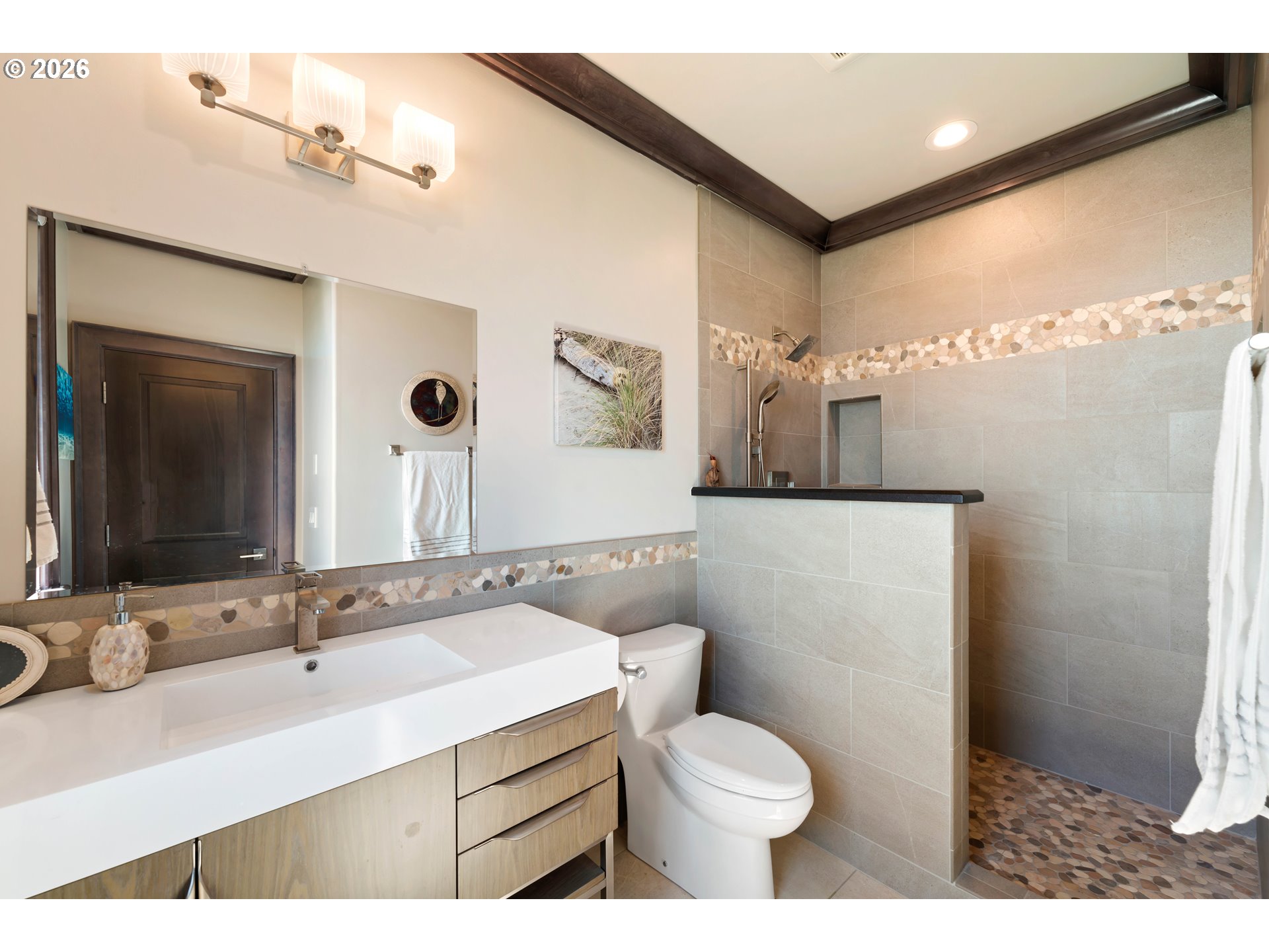 2488 Beach Loop Road Bandon, OR 97411 - Photo 45 of 48 a bathroom with a sink toilet and mirror