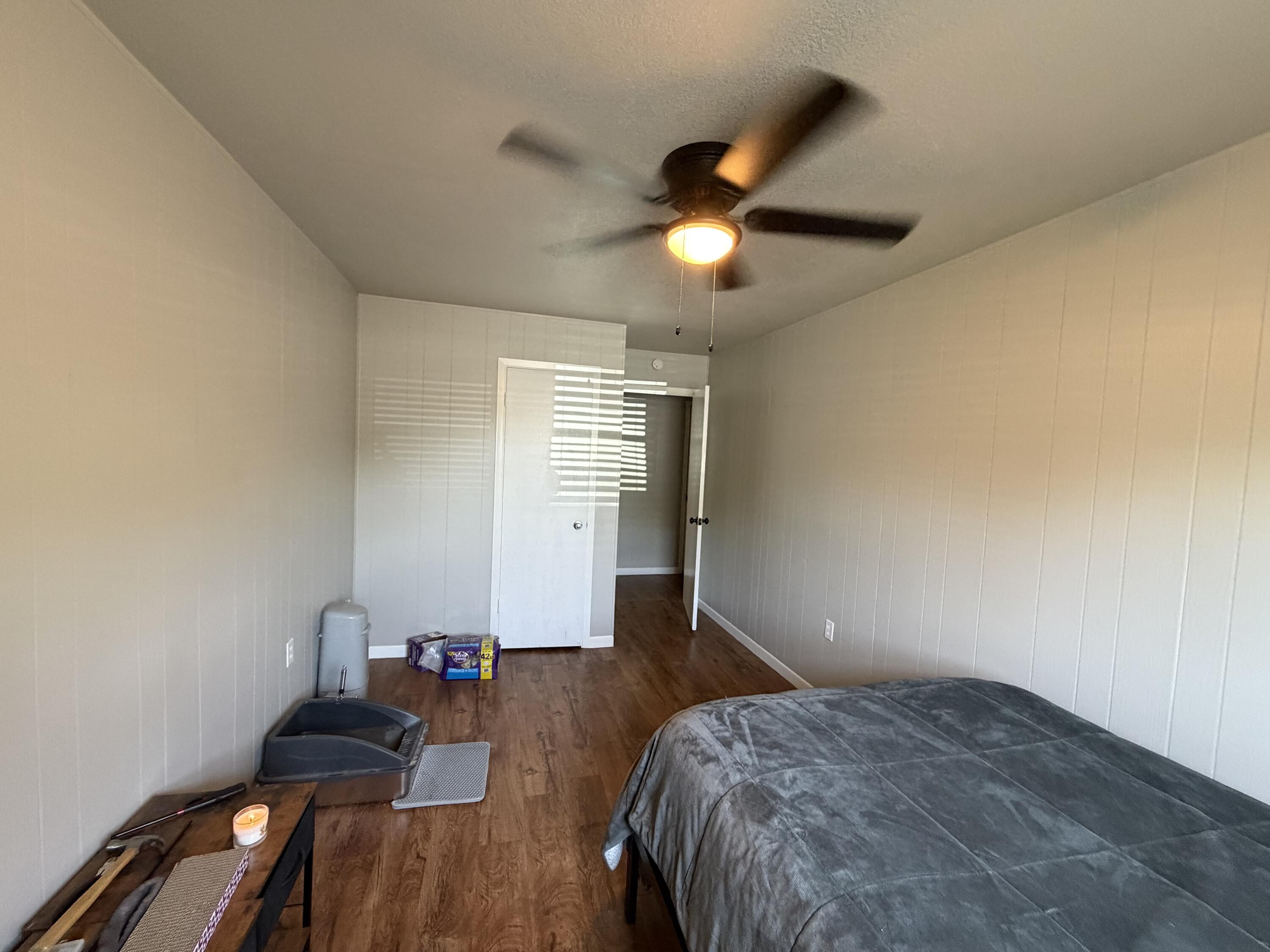 2202 58th Street Lubbock, TX 79412 - Photo 14 of 37 a bedroom with bed and a chandelier