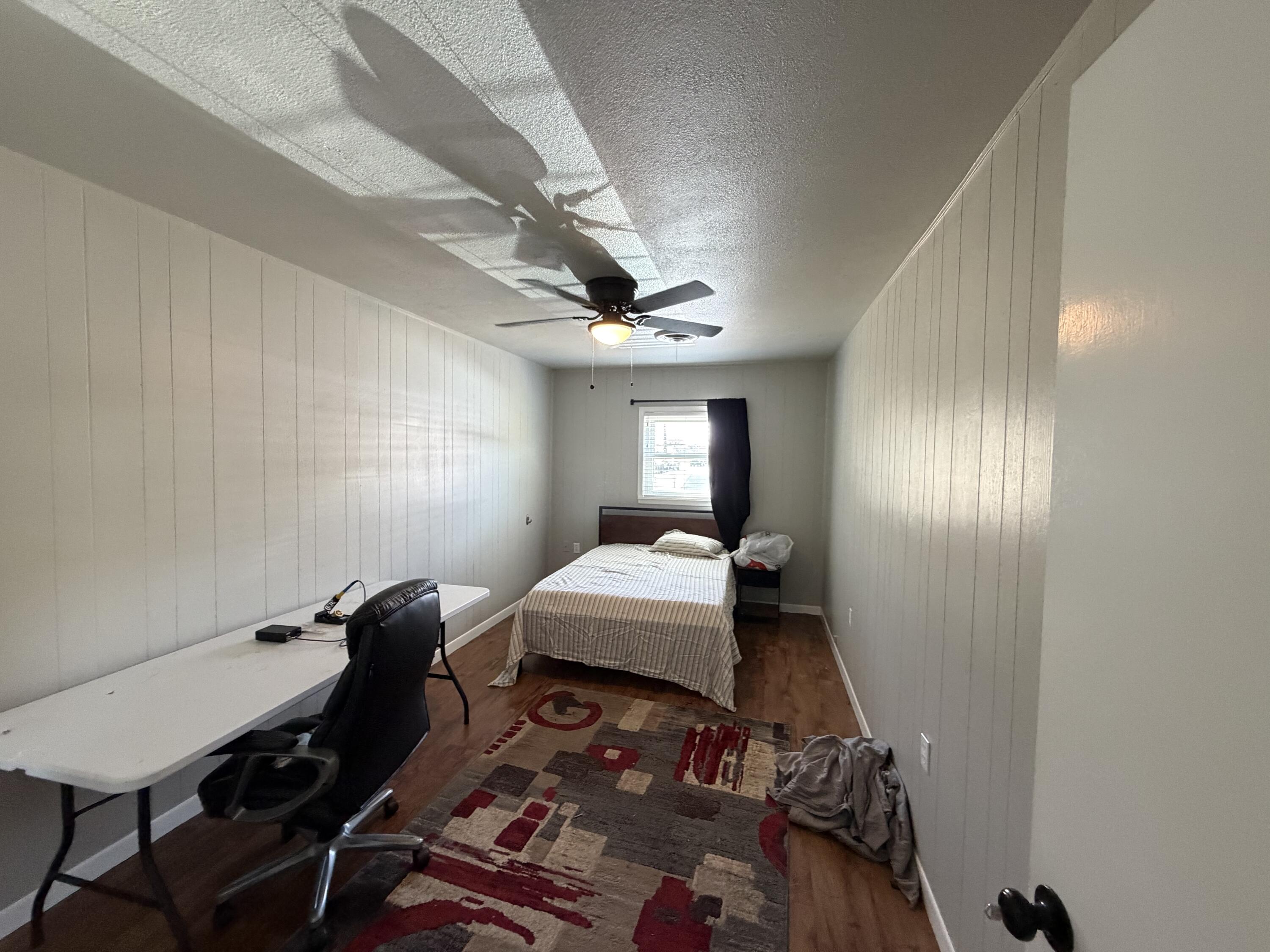 2202 58th Street Lubbock, TX 79412 - Photo 15 of 37 a bedroom with furniture and a window
