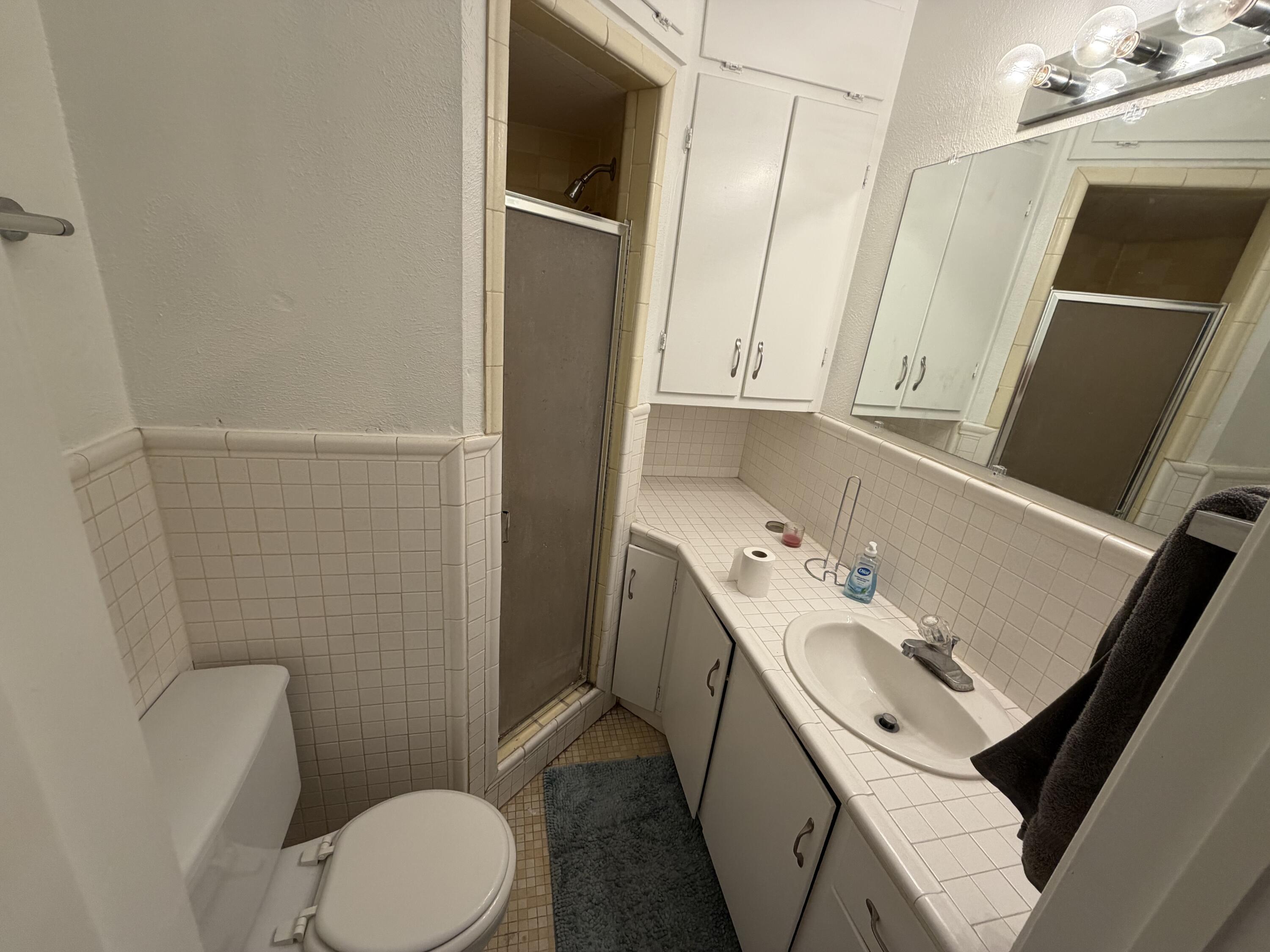 2202 58th Street Lubbock, TX 79412 - Photo 17 of 37 a bathroom with a sink toilet and tub
