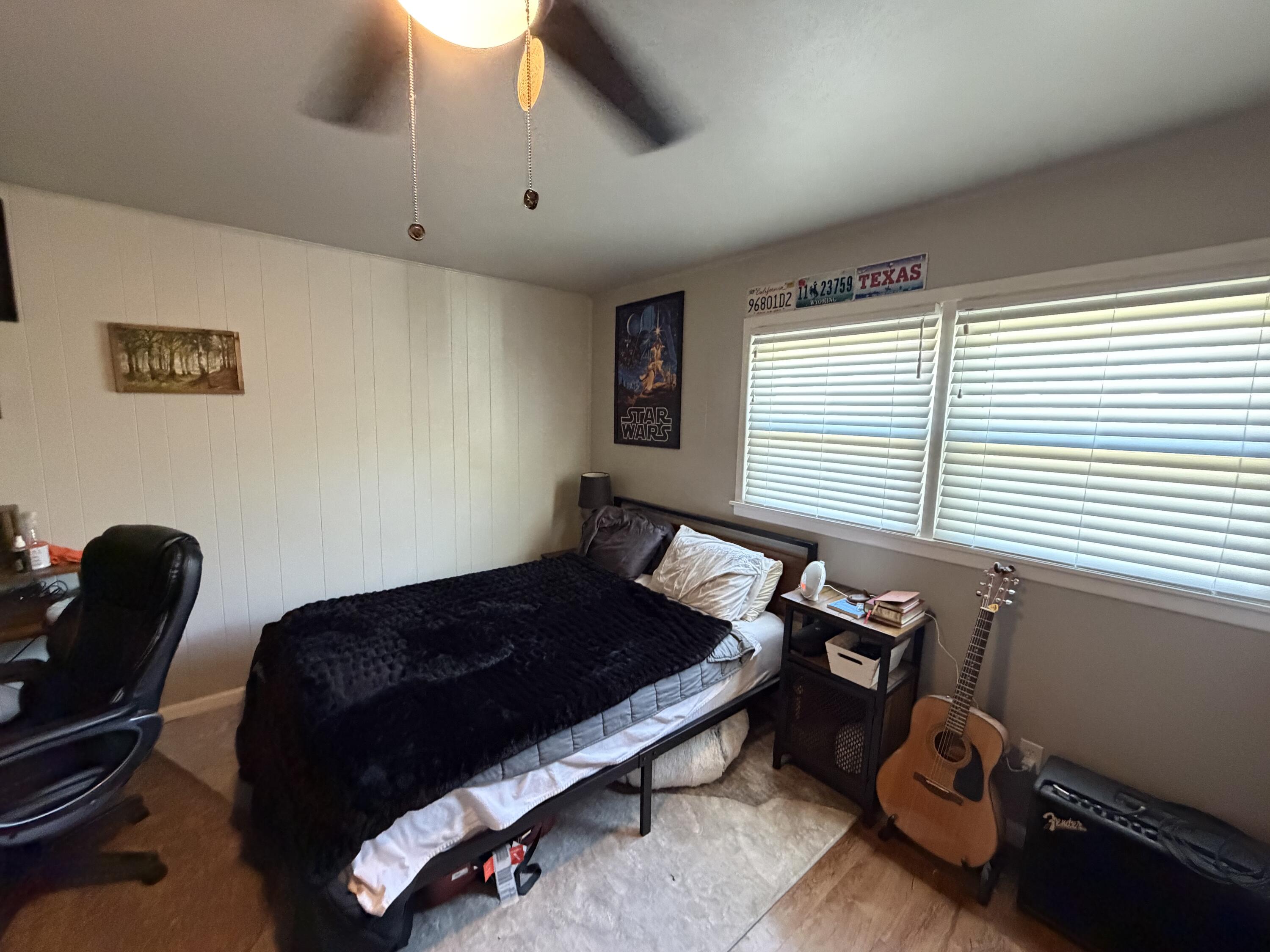2202 58th Street Lubbock, TX 79412 - Photo 20 of 37 a bedroom with furniture and a window