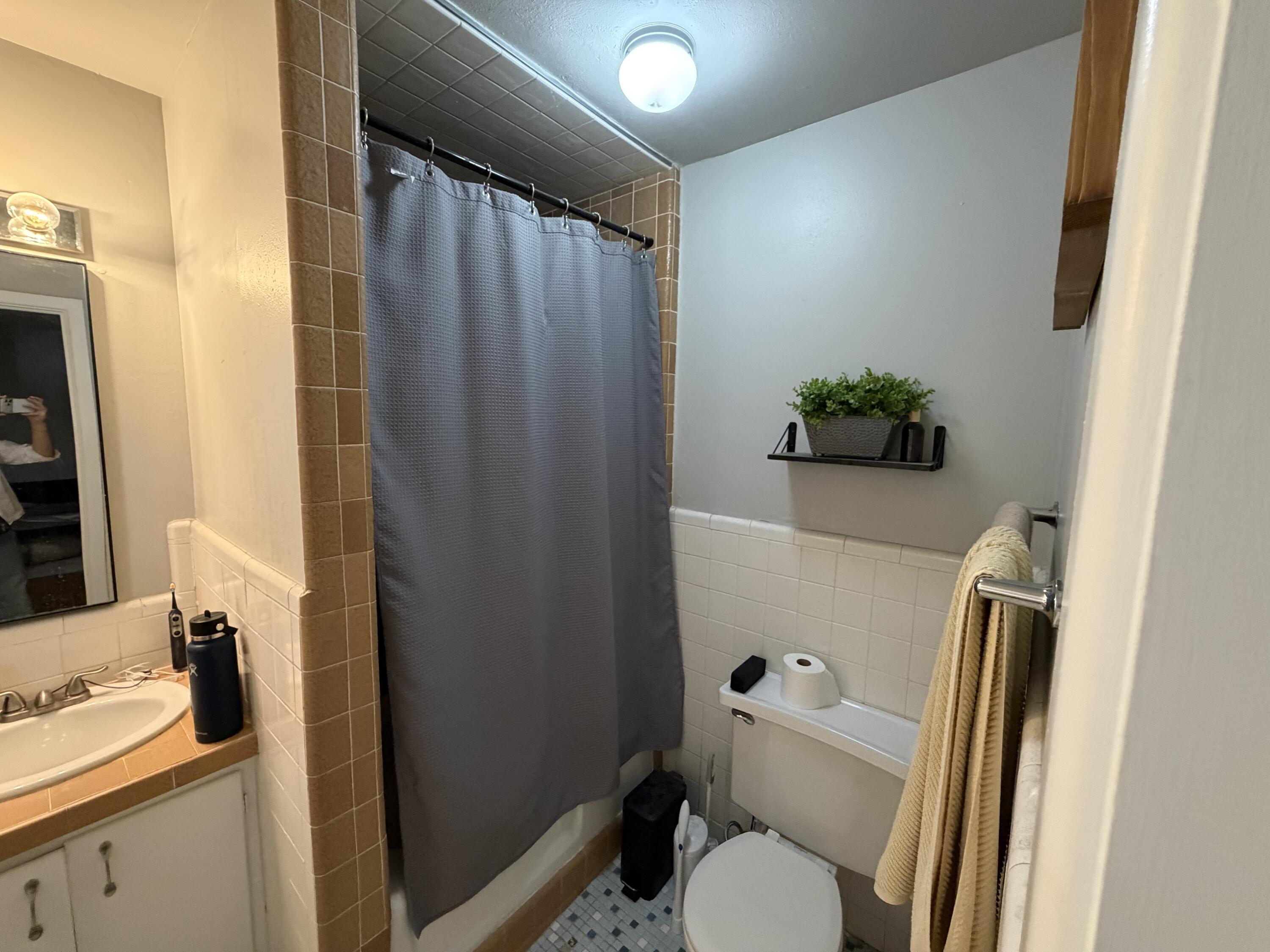 2202 58th Street Lubbock, TX 79412 - Photo 25 of 37 a bathroom with a sink toilet and shower