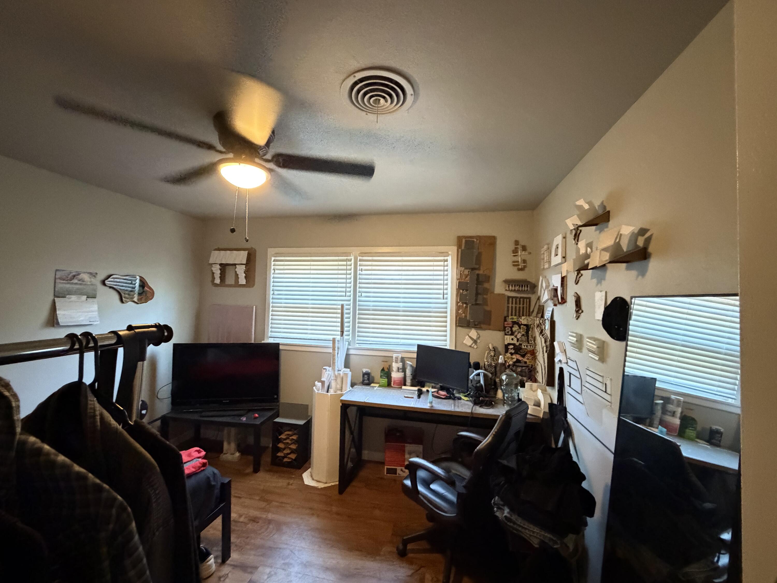 2202 58th Street Lubbock, TX 79412 - Photo 26 of 37 a view of a livingroom with furniture and a flat screen tv