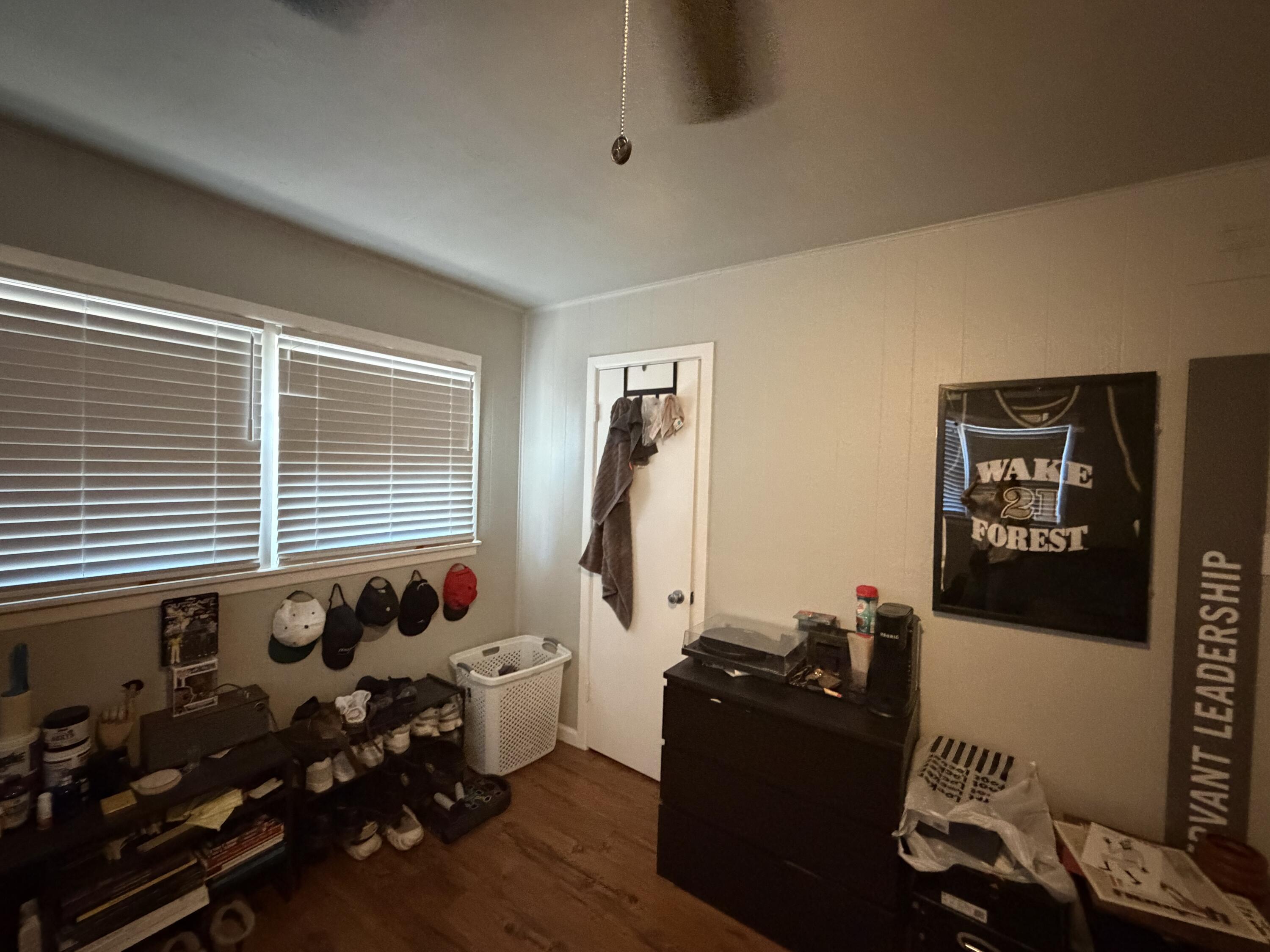 2202 58th Street Lubbock, TX 79412 - Photo 34 of 37 a living room with furniture window and gym equipment