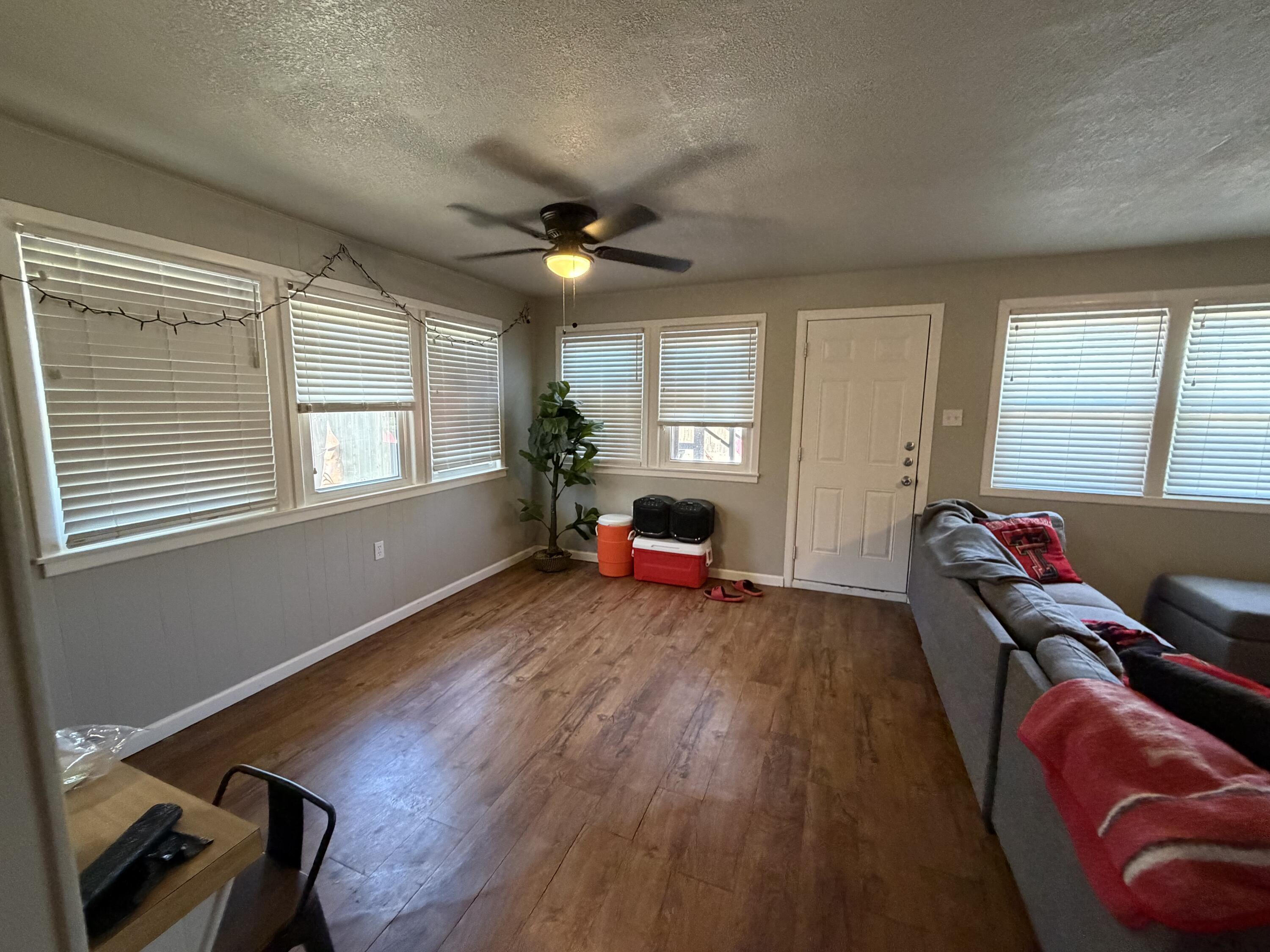 2202 58th Street Lubbock, TX 79412 - Photo 9 of 37 a living room with furniture and a window
