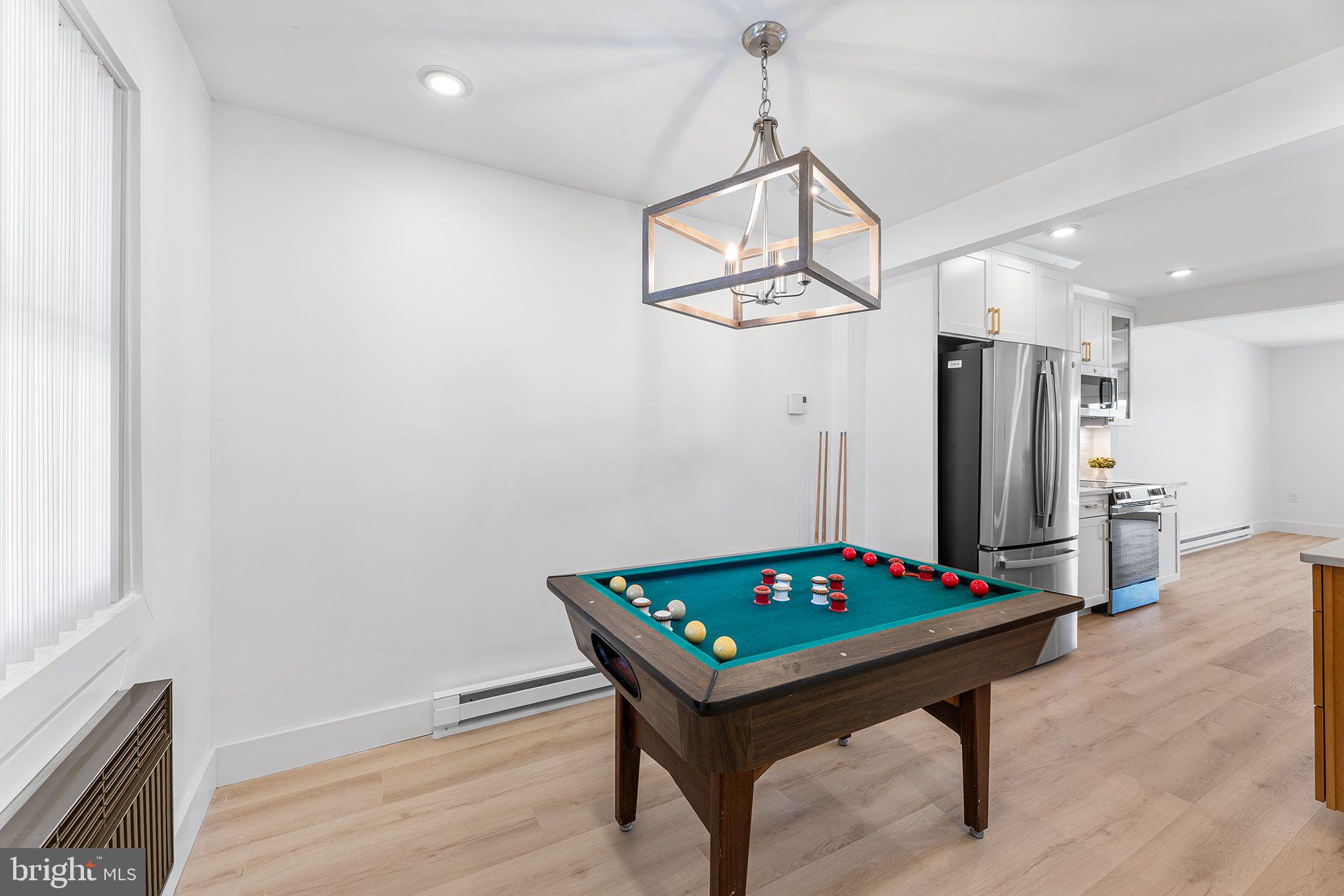 615 Salt Spray Road, Unit 3E Ocean City, MD 21842 - Photo 16 of 39 Dining area (foosball excluded)