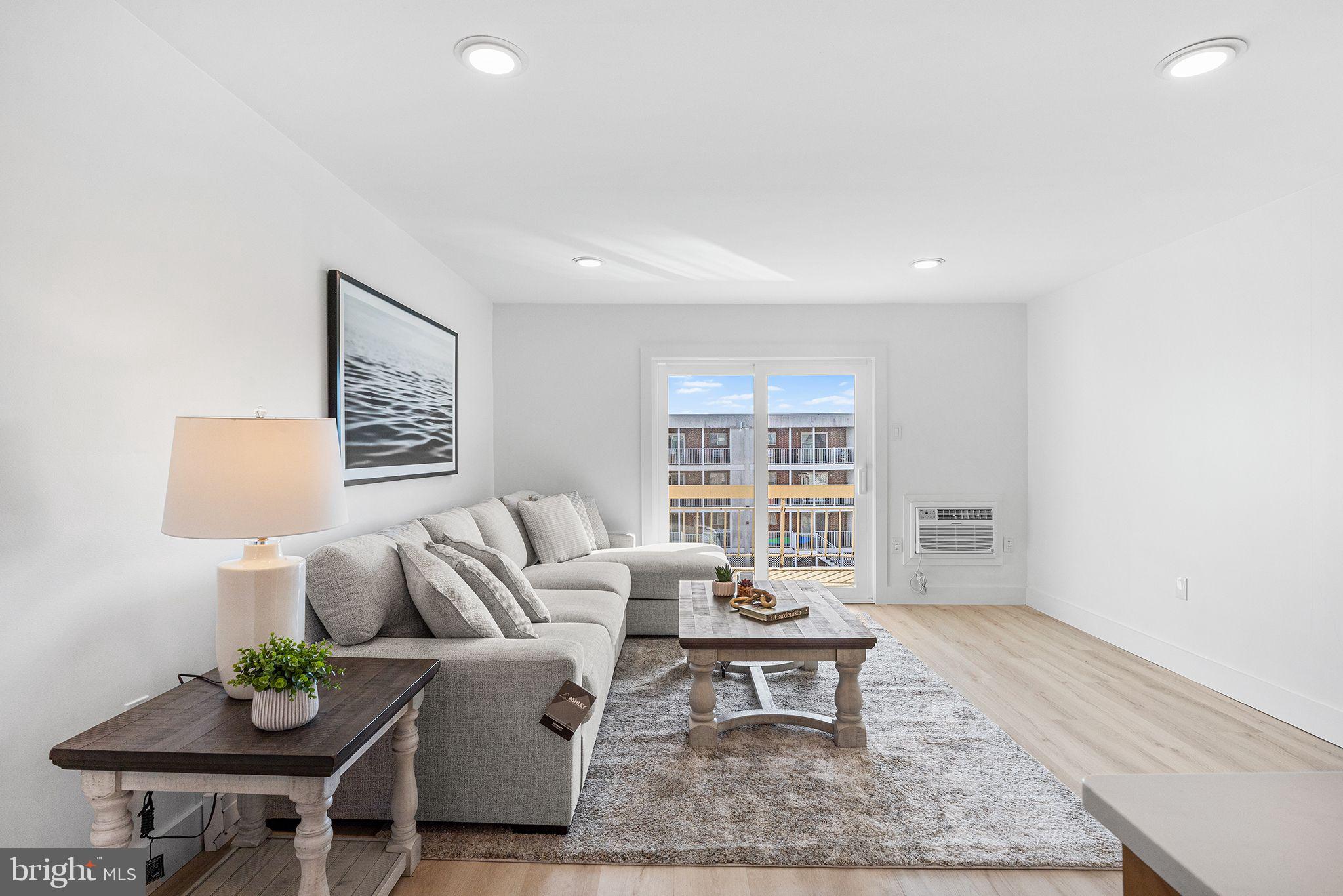 615 Salt Spray Road, Unit 3E Ocean City, MD 21842 - Photo 25 of 39 Living Room looking toward balcony/slider