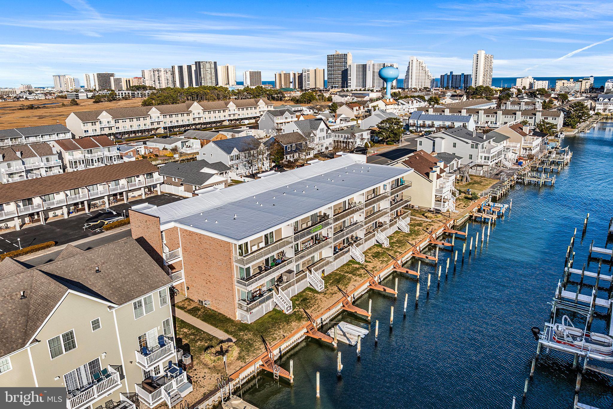 615 Salt Spray Road, Unit 3E Ocean City, MD 21842 - Photo 9 of 39 Aerial view showing canal and boatslips