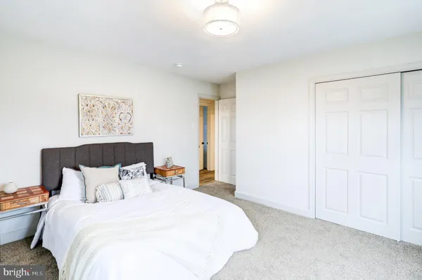 a bedroom with bed and window