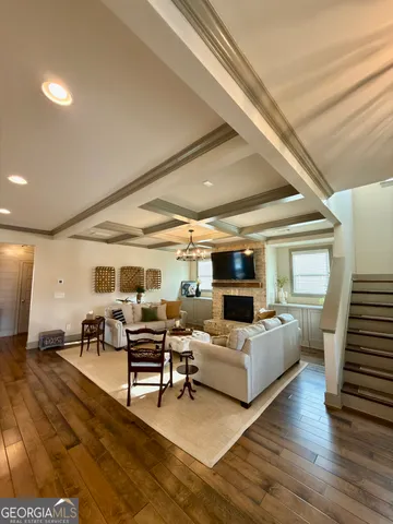 a kitchen with refrigerator a sink and chairs