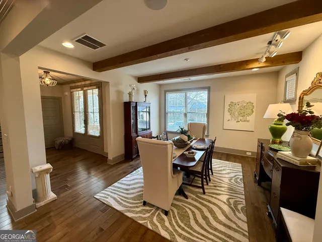 a bathroom with a sink mirror and toilet