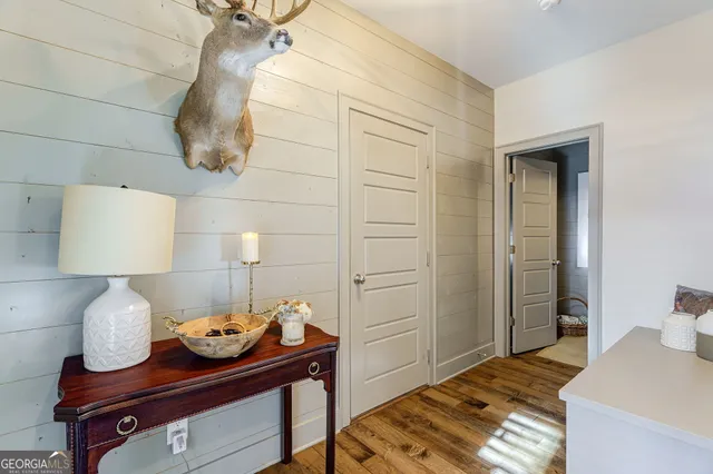 a bedroom with a bed a bed and a chandelier