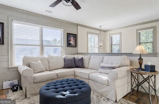 a bathroom with a granite countertop double vanity sink mirror and