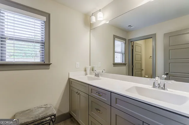 a view of a chairs and table in the back yard
