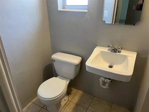a bathroom with a sink and mirror
