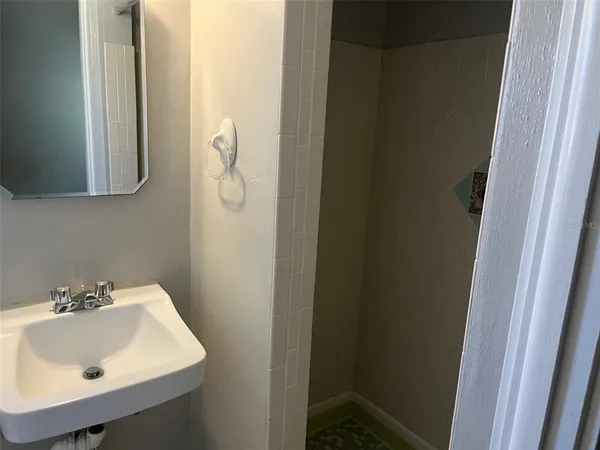 a kitchen with metallic refrigerator freezer and a dishwasher