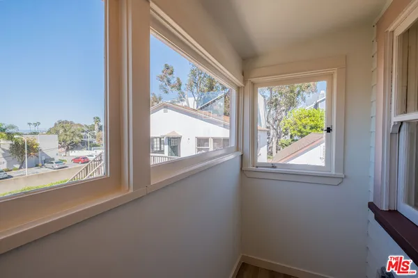a view of a room that has a window in it