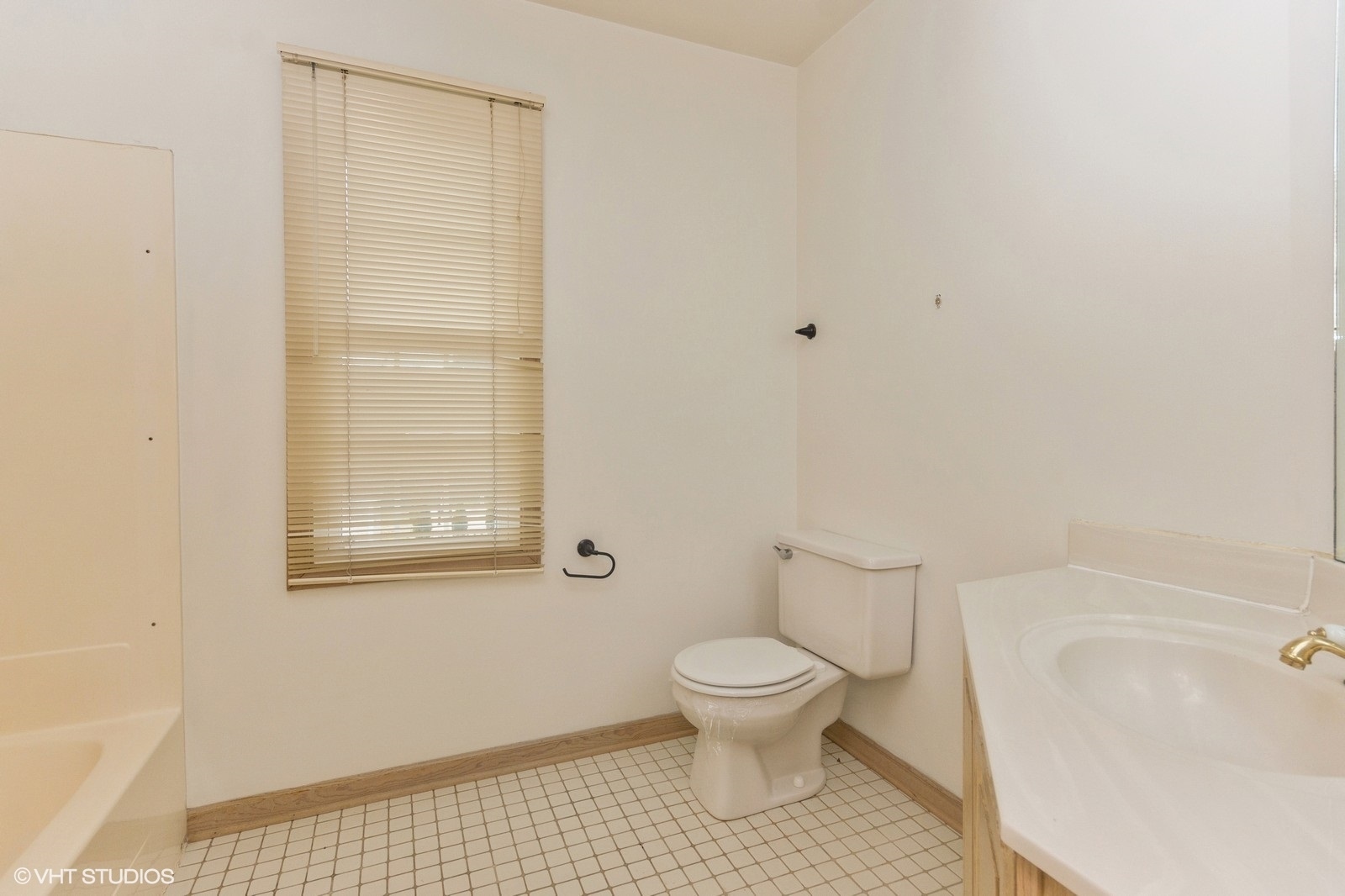4418 Riverside Drive Plainfield, IL 60586 - Photo 12 of 21 a white toilet sitting next to a bathroom sink