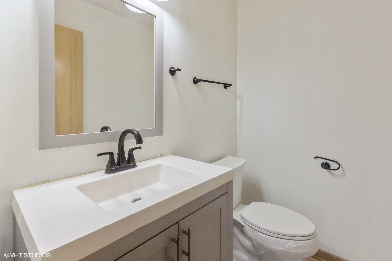 4418 Riverside Drive Plainfield, IL 60586 - Photo 7 of 21 a bathroom with a sink toilet and a mirror