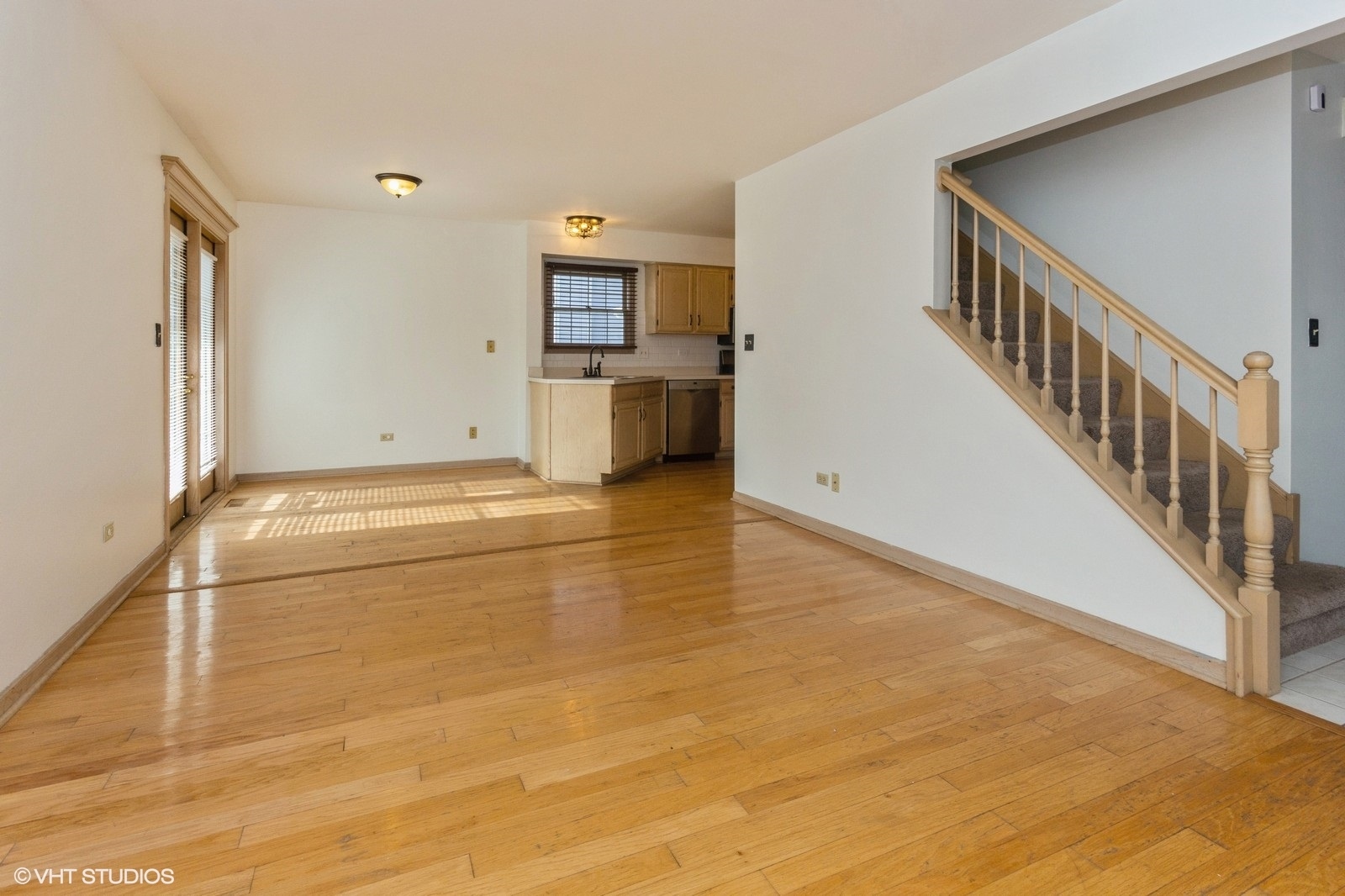 4418 Riverside Drive Plainfield, IL 60586 - Photo 8 of 21 a view of a hallway with wooden floor and a kitchen