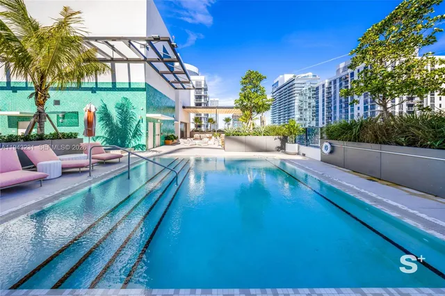 a view of a swimming pool with a patio
