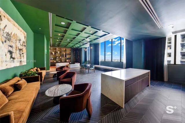 a view of a livingroom with furniture and window