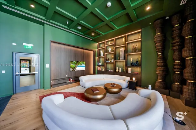 a living room with furniture and a potted plant