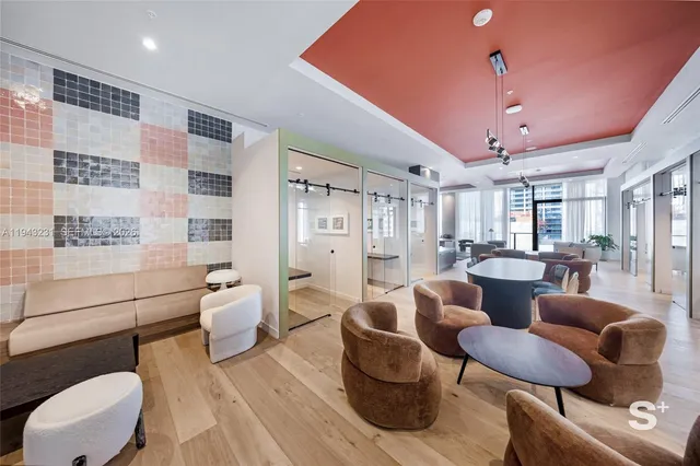 a living room with furniture and a rug