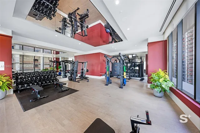 a view of living room filled with furniture and flowers