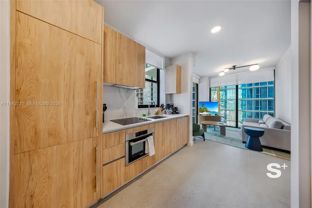a kitchen with sink cabinets and outdoor view