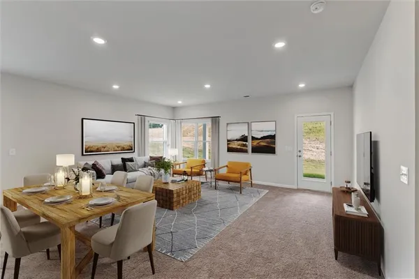 a living room with furniture kitchen view and a window