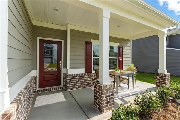 an outdoor view of a house with outdoor seating