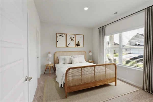 a bedroom with a bed and a large window