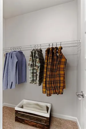 a view of a living room with clothes