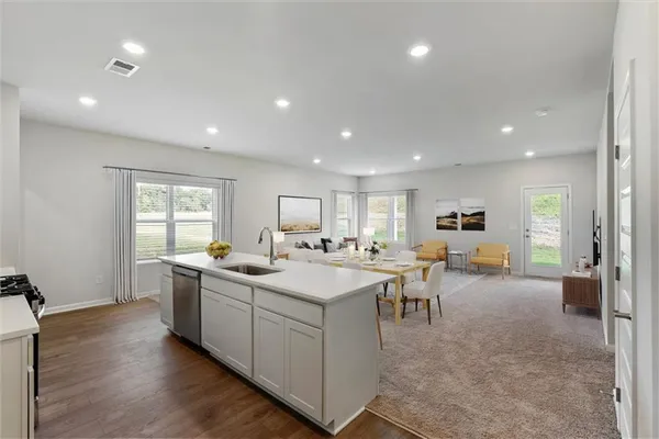a view of a living room and dining room