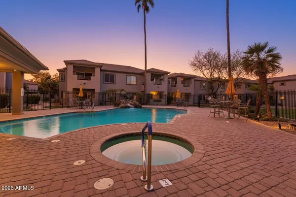 a swimming pool with outdoor seating and yard