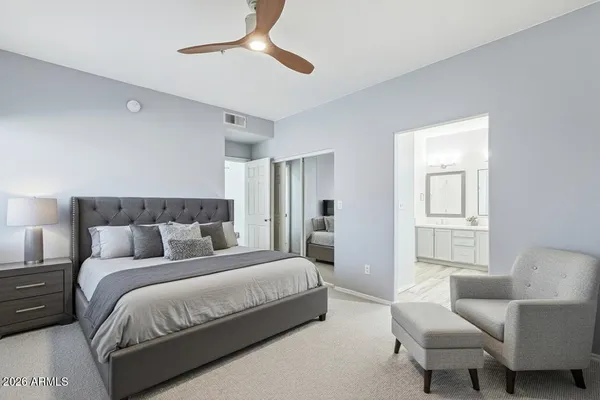 a bedroom with bed and window