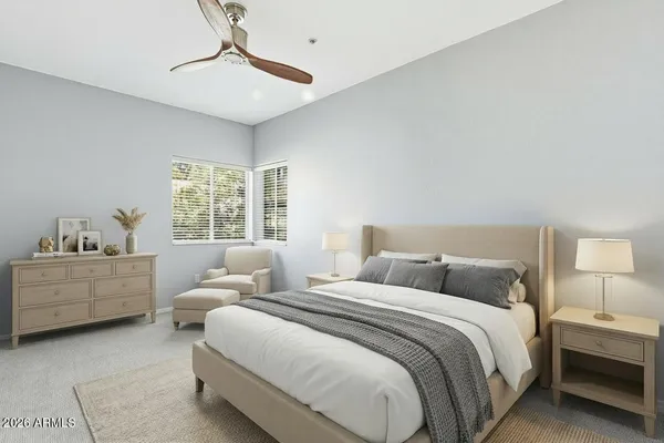 a bed room with a bed and a window